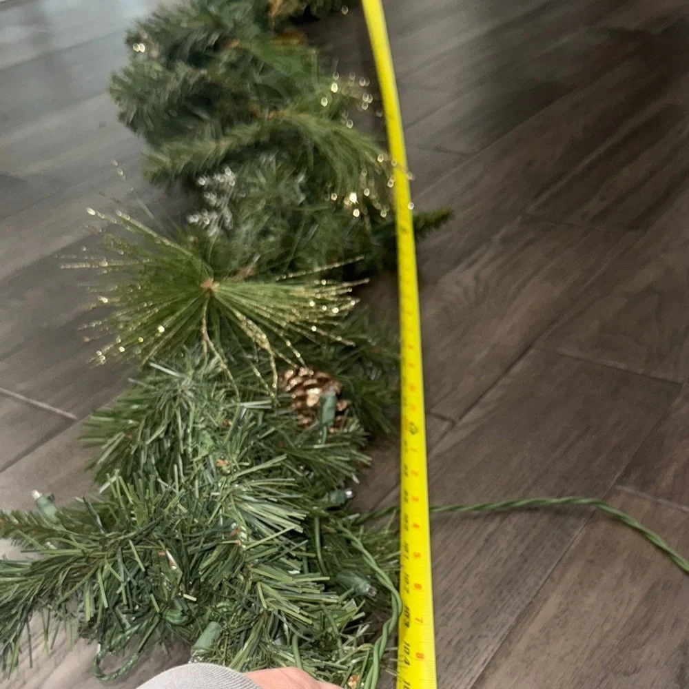Festive Green Holiday Garland with Gold Accents and lights